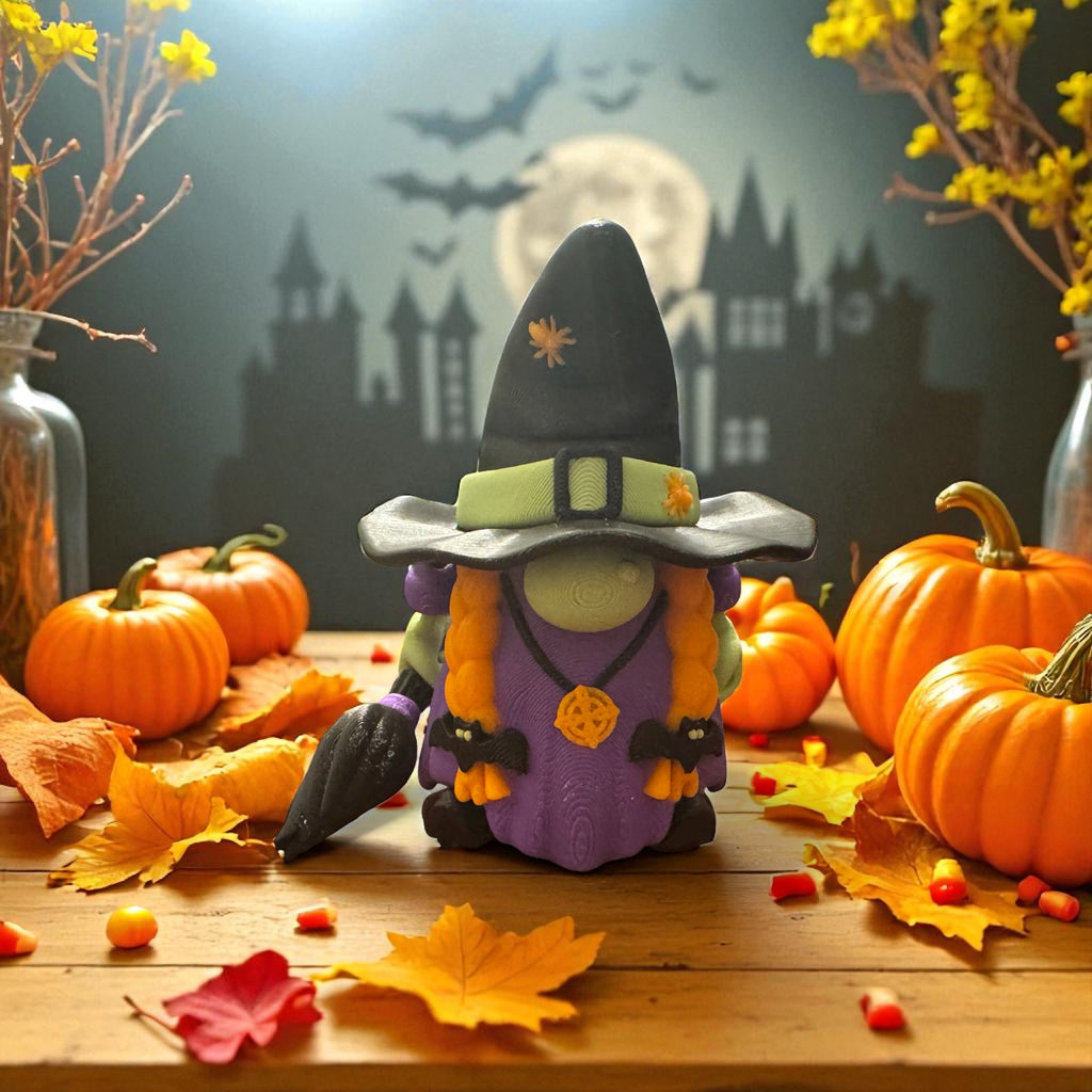 Halloween-themed decoration with a witch figurine, pumpkins, and autumn leaves on a wooden table.